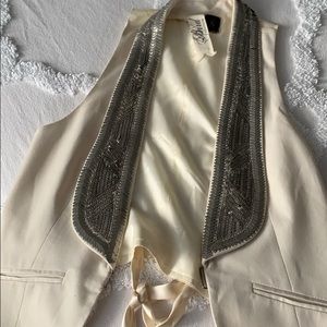 Cream metal sequined vest.